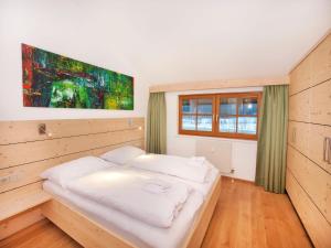 Un ou plusieurs lits dans un hébergement de l'établissement Apartment in Wald im Pinzgau with Swimming Pool and Views