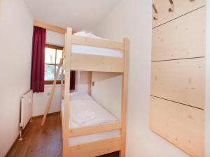 Un ou plusieurs lits dans un hébergement de l'établissement Apartment in Wald im Pinzgau with Swimming Pool and Views