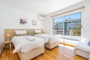 Postel nebo postele na pokoji v ubytování Marina Vilamoura Triplex