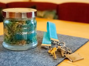 a jar of moon hormone next to a pair of keys at Modern Apartment in Kitzbuhel near Ski Area in Kitzbühel