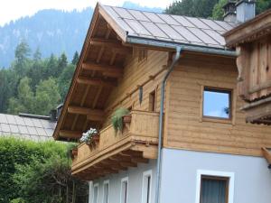 a house with a balcony on the side of it at Modern Apartment in Kitzbuhel near Ski Area in Kitzbühel +71 photos