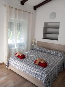 Postel nebo postele na pokoji v ubytování Agriturismo U muinettu