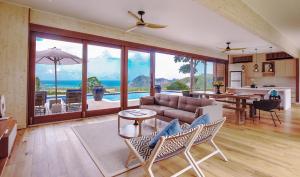 a living room with a couch and a table at Selong Selo Resort and Residences in Selong Belanak