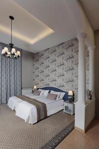 Ένα ή περισσότερα κρεβάτια σε δωμάτιο στο Grand Hotel Bois De Boulogne +14 φωτογραφίες