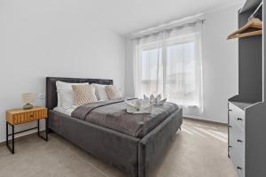 a bedroom with a large bed and a window at Peninsula Villas in Premantura +25 photos