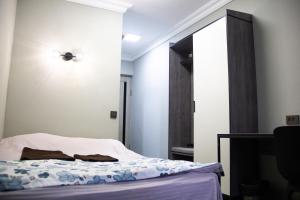 Postel nebo postele na pokoji v ubytování Hotel Tahar