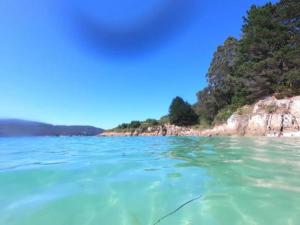 a view of the ocean from a boat in the water at Pension O Remo in O Vicedo