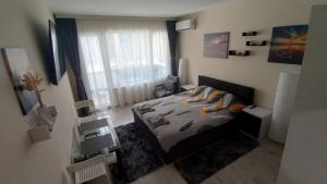 Μια τηλεόραση ή/και κέντρο ψυχαγωγίας στο Cosy Apartment