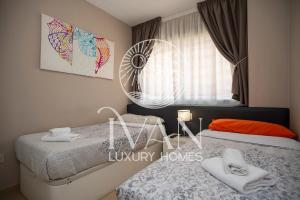 Posteľ alebo postele v izbe v ubytovaní Casa Miriam Ivan Luxury Homes 2ªPlta Sur 1ªLinea