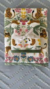 a quilt with a cheetah and leopard print at Central Guest Studio - En-Suite - Vibrant London in London