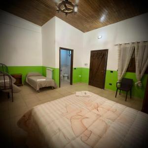 a bedroom with a large bed and green walls at Le Chiancate in San Giovanni Rotondo +25 photos