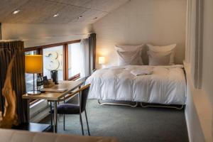 Voodi või voodid majutusasutuse Hotel Birksø toas