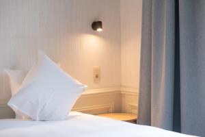Postel nebo postele na pokoji v ubytování Hotel Lucca