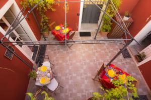 an overhead view of a house with a table and chairs at S'Attobiu Guest Rooms in Teulada