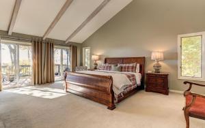 a large bedroom with a bed and a window at Vista Haven - Mountain Views and Fireplace and Big Screen TVs and Extras in Jasper +37 photos