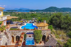 an aerial view of a house with a swimming pool at Villa Octavius in Ráchi
