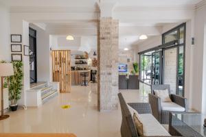 a living room with chairs and a lobby at Bayram Hotel in Çeşme
