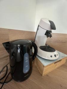 Kaffe- og tefaciliteter på Appartement 6 chambres