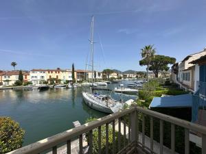 a group of boats docked in a river with buildings at Maison de Pêcheur à Port Grimaud 2 in Grimaud