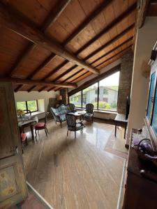 a large living room with a wooden ceiling at Sant'Andrea - Monticello Apartments in Medesano +9 photos