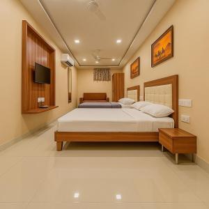StayGuru Park View Residency客房内的一张或多张床位