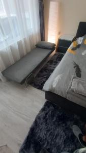 Ένα ή περισσότερα κρεβάτια σε δωμάτιο στο Cosy Apartment