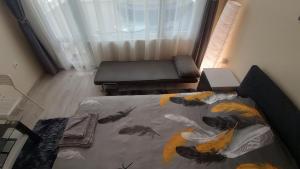 Ένα ή περισσότερα κρεβάτια σε δωμάτιο στο Cosy Apartment