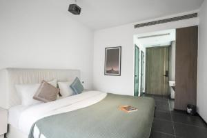 Voodi või voodid majutusasutuse Time Wharf Hotel - Jiefangbei Shibati Branch toas