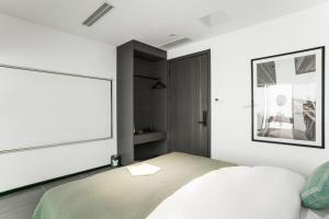 Voodi või voodid majutusasutuse Time Wharf Hotel - Jiefangbei Shibati Branch toas