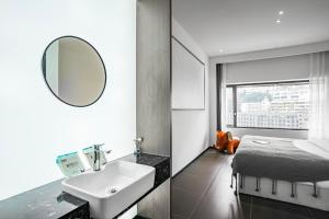 Voodi või voodid majutusasutuse Time Wharf Hotel - Jiefangbei Shibati Branch toas