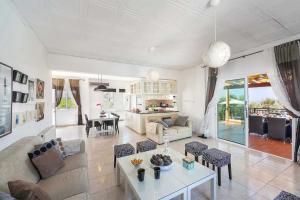 a living room with a couch and a table at Pine Retreat in Argaka