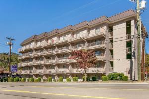 an apartment building on the corner of a street at Sleep Inn & Suites near Sports World Blvd in Gatlinburg