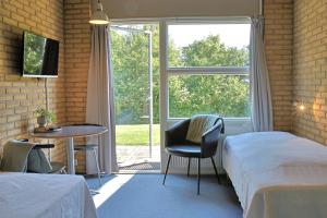 Postel nebo postele na pokoji v ubytování Flinten Horsens