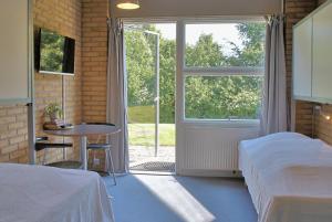 Postel nebo postele na pokoji v ubytování Flinten Horsens
