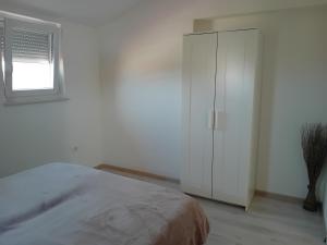 Posteľ alebo postele v izbe v ubytovaní Apartman Dezire