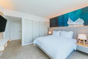 Postel nebo postele na pokoji v ubytování Radisson Blu Aruba