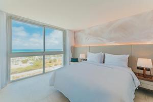 Postel nebo postele na pokoji v ubytování Radisson Blu Aruba