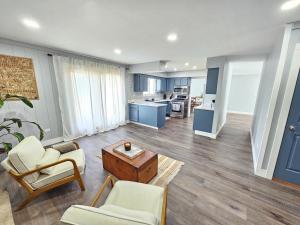 a living room with a couch and chairs and a table at Modern 4BR Near Six Flags & Naval Base in Gurnee