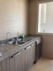 Kuchyň nebo kuchyňský kout v ubytování Superbe appartement à Prestigia Golf City