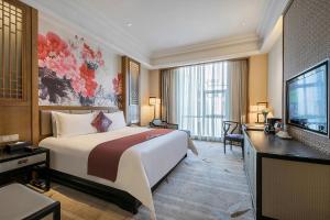 Voodi või voodid majutusasutuse Anji Dingshangyi Hotel toas +11 fotot