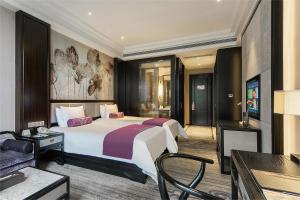 Voodi või voodid majutusasutuse Anji Dingshangyi Hotel toas