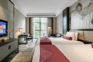 Voodi või voodid majutusasutuse Anji Dingshangyi Hotel toas