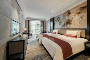 Voodi või voodid majutusasutuse Anji Dingshangyi Hotel toas