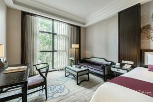 Voodi või voodid majutusasutuse Anji Dingshangyi Hotel toas