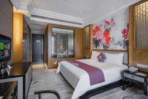 Voodi või voodid majutusasutuse Anji Dingshangyi Hotel toas