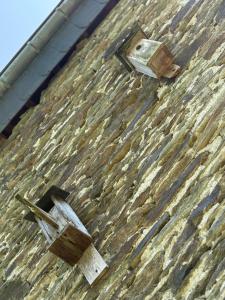 a wooden latch on the side of a building at Arduinna's Nest B&B in Neufchâteau