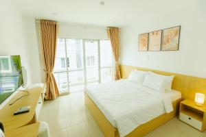 Postel nebo postele na pokoji v ubytování BIG Hotel Sài Gòn