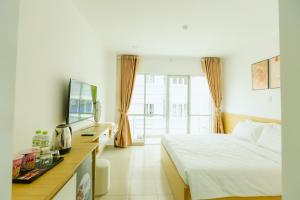 Postel nebo postele na pokoji v ubytování BIG Hotel Sài Gòn