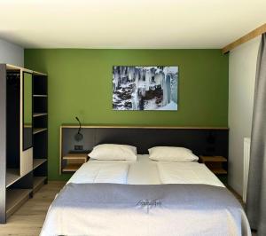 Cama ou camas em um quarto em Hotel Simader