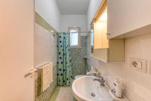 a bathroom with a sink and a shower at Villa Terra Rossa in Torre San Giovanni Ugento +36 photos